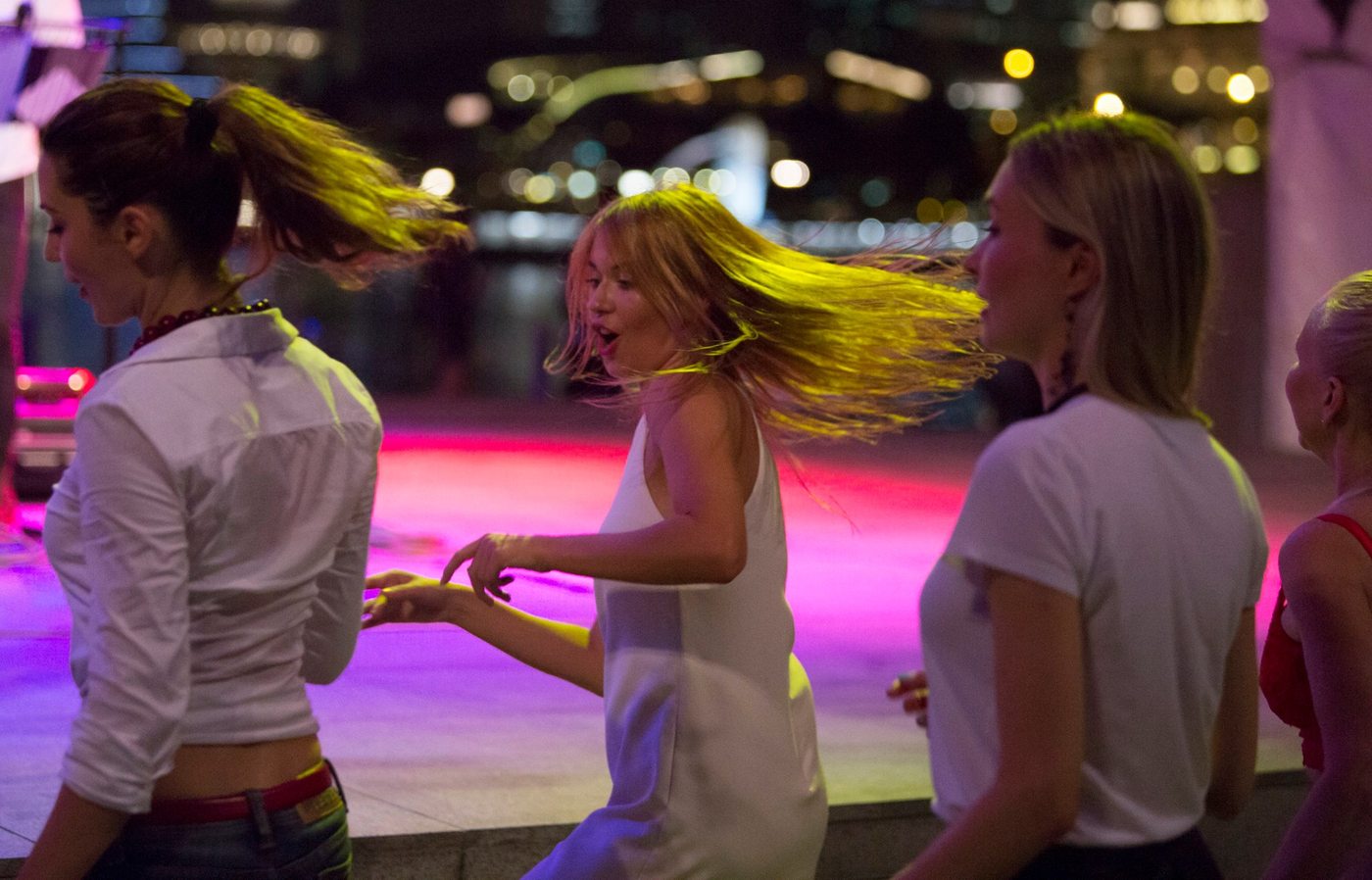 Crowd dancing at live band Singapore outdoor night event